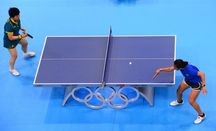 This picture taken with a robotic camera shows Australia's Jian Fang Lay (L) playing a stroke with Brazil's Ligia Silva (R) during their first round women's table-tennis match for the London 2012 Olympic Games in London on July 28, 2012. AFP PHOTO / ANTONIN THUILLIER (Photo credit should read ANTONIN THUILLIER/AFP/GettyImages)